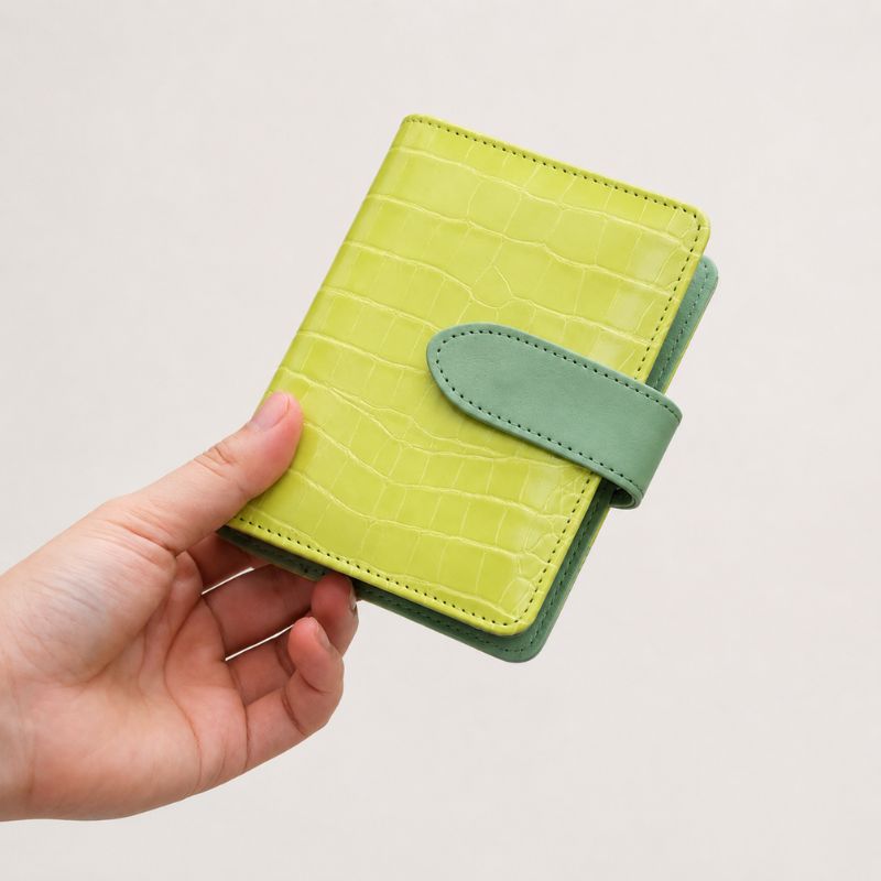 Closed lime-green crocodile-texture Nomad kit with sage trim